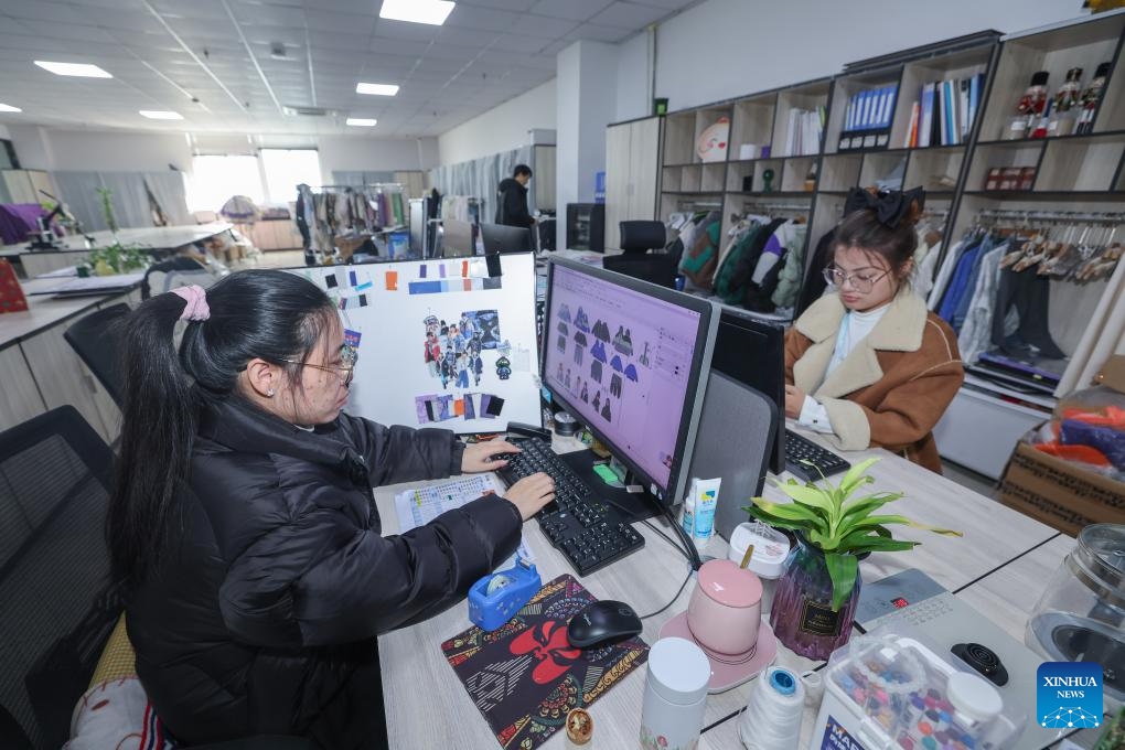 Designers design children's garment at a garment enterprise in Zhili Town of Huzhou City, east China's Zhejiang Province, Feb. 27, 2024. Zhili, located in the Yangtze River Delta economic circle, is renowned for its children's garment industry, whose complete industrial chain covers design, production, sales, storage, and logistics.(Photo: Xinhua)