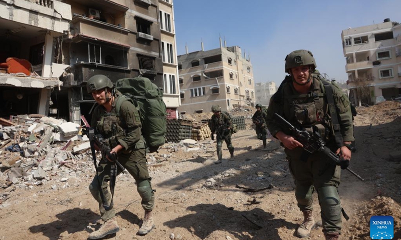 Israeli troops conduct military operations in the southern Gaza Strip city of Khan Yunis, on Feb. 28, 2024. More than 30,000 Palestinians have been killed in the Gaza Strip since Israel began its offensive against Hamas in October, the Hamas-run health ministry said on Thursday as the Israeli army fired at a crowd of people waiting for humanitarian aid in western Gaza, killing at least 104 people.(Photo: Xinhua)