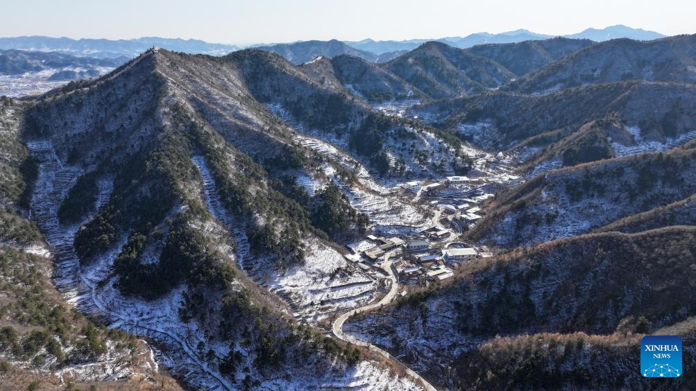 An aerial drone photo taken on Feb. 22, 2024 shows a view of Qian'ganjian Village, Xiaying Township, north China's Tianjin. Before this year's Spring Festival, three villages including Qian'ganjian Village of Tianjin, Qian'ganjian Village of Hebei Province and Hongshimen Village of Beijing, all located at a border area between Tianjin, Hebei and Beijing, signed an agreement to jointly develop the tourism in the area and better protect the ancient Great Wall.(Photo: Xinhua)