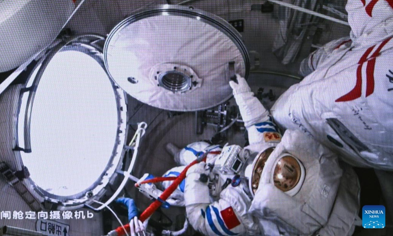 This screen image captured at Beijing Aerospace Control Center on March 2, 2024 shows Shenzhou-17 astronaut opening the hatch of space station lab module Wentian's airlock cabin before extravehicular activities. The Shenzhou-17 crew members, who are currently on board China's space station, have completed their second extravehicular mission on Saturday. (Photo: Xinhua)