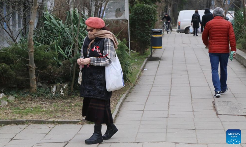 A woman wearing Martenitsa is seen in Sofia, Bulgaria, March 1, 2024. Bulgarian people marked the day named Baba Marta on Friday. On that day and a few days afterwards, Bulgarians exchange and wear the so-called Martenitsa - a small piece of adornment, made of white and red yarn. (Photo: Xinhua)