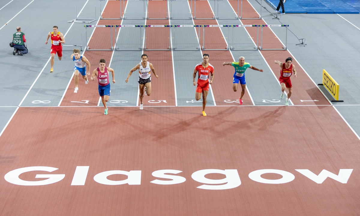 Chinese hurdler Liu Junxi (right) competes in the heats of the men's 60-meter hurdles at the World Athletics Indoor Championships in Glasgow, Scotland, on March 2, 2024. Liu and compatriot Zhu Shenglong both qualified for the semifinals. Photo: VCG