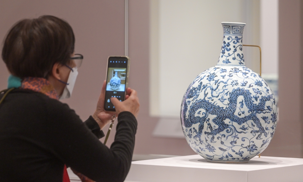 A visitor explores an exhibiton at the Hong Kong Palace Museum. Photo: VCG