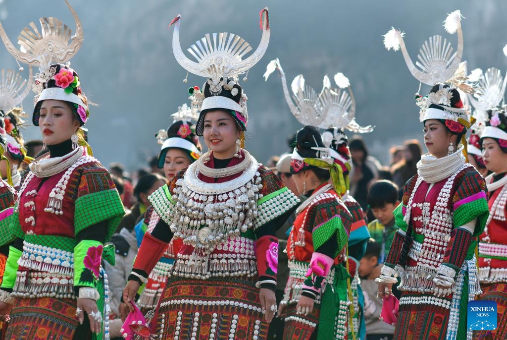 Girls of Miao ethnic group perform a dance in celebration of the Gannangxiang festival in Kaili, Qiandongnan Miao and Dong Autonomous Prefecture, southwest China's Guizhou Province, March 2, 2024. In Kaili, local ethnic Miao people have the custom of donning their traditional attire and performing Lusheng, a traditional musical instrument, to rejoice in the annual Gannangxiang festival, a time-honored celebration in Guizhou Province. (Photo: Xinhua)