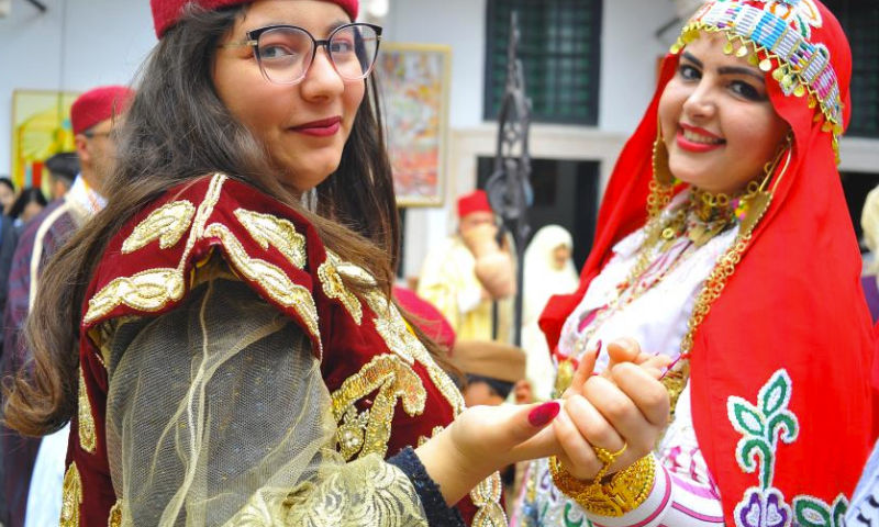 People dressed in traditional costumes attend a celebration for the national day of traditional dress in Tunis, Tunisia, on March 10, 2024. (Photo by Adel Ezzine/Xinhua)