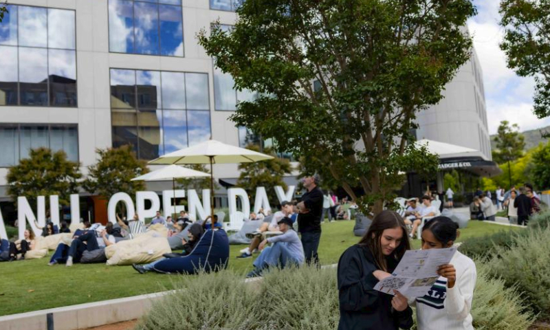 This photo taken on March 16, 2024 shows the open day sign at the Australian National University (ANU) in Canberra, Australia. The ANU held the annual open day event on Saturday, introducing the school's history, major settings to students and parents, and showcasing teaching facilities and scientific research achievements. (Photo by Chu Chen/Xinhua)