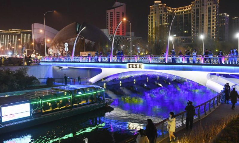 A boat sails in the Liangma River in Beijing, capital of China, March 16, 2024. A promotion event of the Liangma River was held on Saturday in Beijing.

The Liangma River traverses diverse areas, including foreign embassies, international hotels, department stores, and trendy commercial streets, connecting various international business districts in Beijing.

In 2019, the city's Chaoyang District embarked on a waterfront project along the Liangma River. After two years of development and environmental improvements, the Liangma River has transformed from a mere waterway into a captivating aquatic landscape. It has now become a must-visit destination in Beijing. (Xinhua/Ju Huanzong)