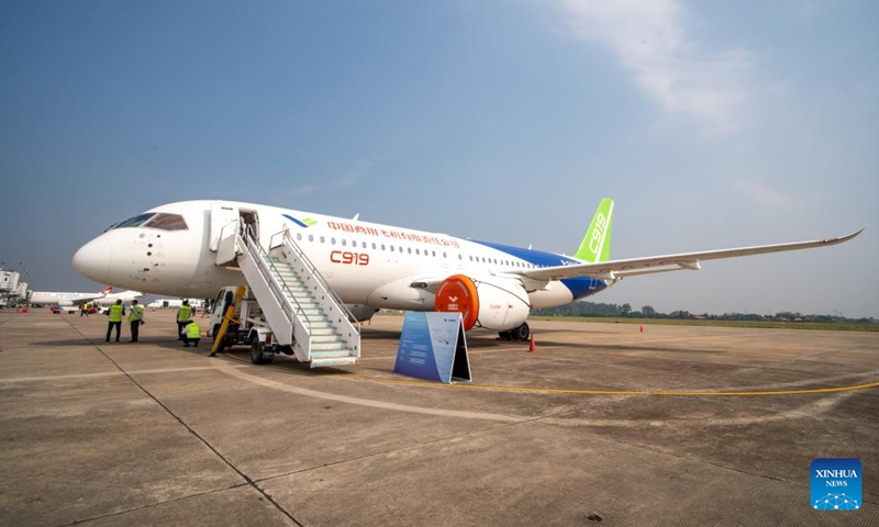 This photo taken on March 4, 2024 shows a Chinese airplane C919 at Wattay International Airport in Vientiane, Laos. Chinese airplanes C919 and ARJ21 developed by the Commercial Aircraft Corporation of China, Ltd. (COMAC) on Monday arrived in Laos for a static display and demonstration flight. The two jetliners flew from Singapore to Vietnam, and then to Laos, after finishing the Singapore Airshow 2024 where they made their first airshow appearances outside China.(Photo: Xinhua)