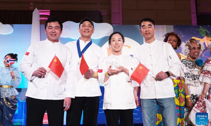 Chefs from the Embassy of the People's Republic of China are seen during the Events DC Embassy Chef Challenge in Washington, D.C., the United States, on March 7, 2024. More than 20 embassies competed in this year's Events DC Embassy Chef Challenge held at the Union Station in Washington, D.C. Thursday night, which captivated the audiences with unique flavors from across the world. (Xinhua)