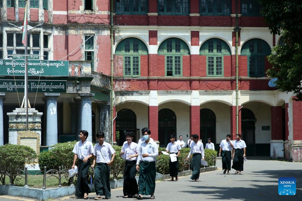 Students leave a high school after a final matriculation exam for the academic year 2023-24 in Yangon, Myanmar, March 11, 2024(Photo: Xinhua)