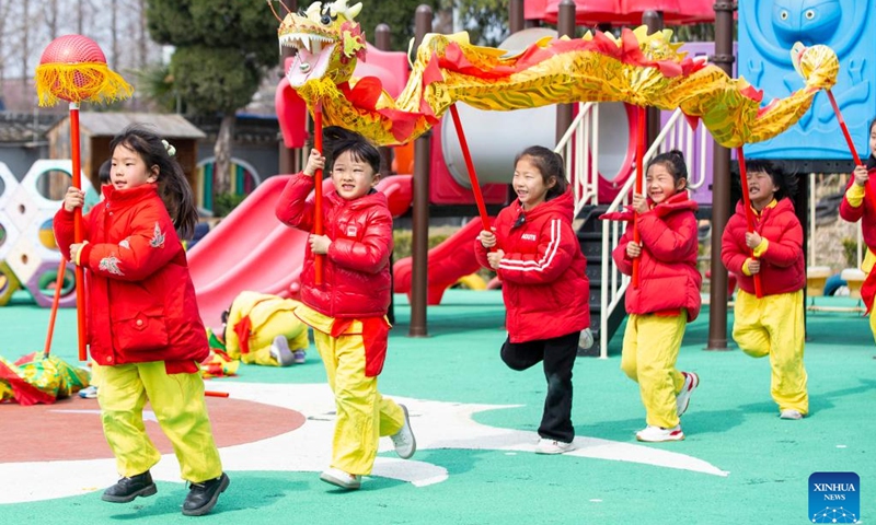 Children perform dragon dance at a kindergarten in Haian City, east China's Jiangsu Province, March 11, 2024. Various celebrations were held across the country for Longtaitou, a traditional day for a new haircut after the Spring Festival. The day of Longtaitou, which literally means dragon raises head, falls on the second day of the second lunar month.(Photo: Xinhua)