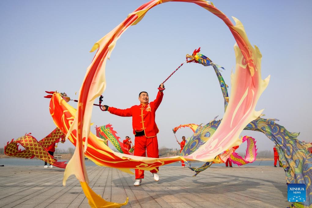 People perform dragon dance in Gaoqing County of Zibo, east China's Shandong Province, March 11, 2024. Various celebrations were held across the country for Longtaitou, a traditional day for a new haircut after the Spring Festival. The day of Longtaitou, which literally means dragon raises head, falls on the second day of the second lunar month.(Photo: Xinhua)