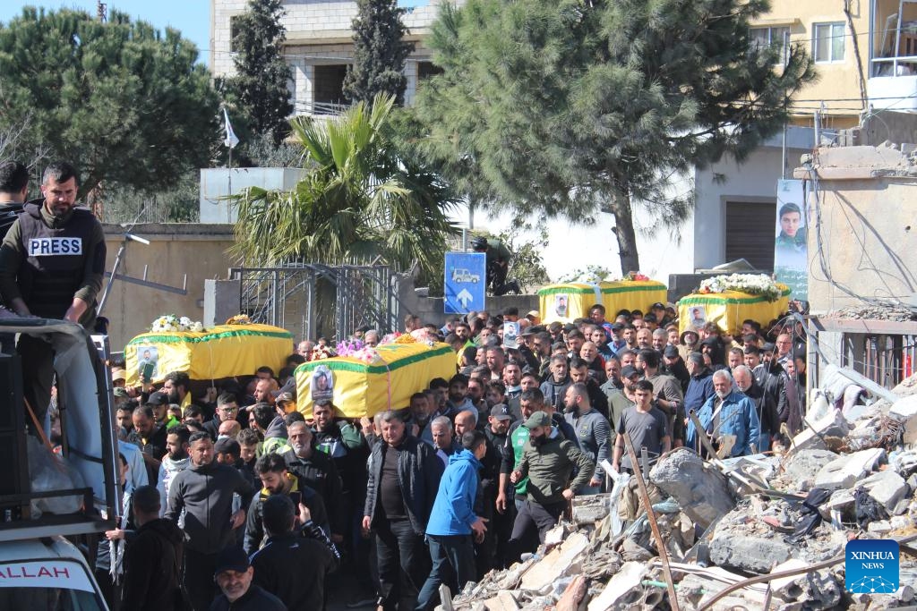 People carry the caskets of four members of one family killed in an Israeli airstrike during a funeral procession in Blida, south Lebanon, March 11, 2024.(Photo: Xinhua)