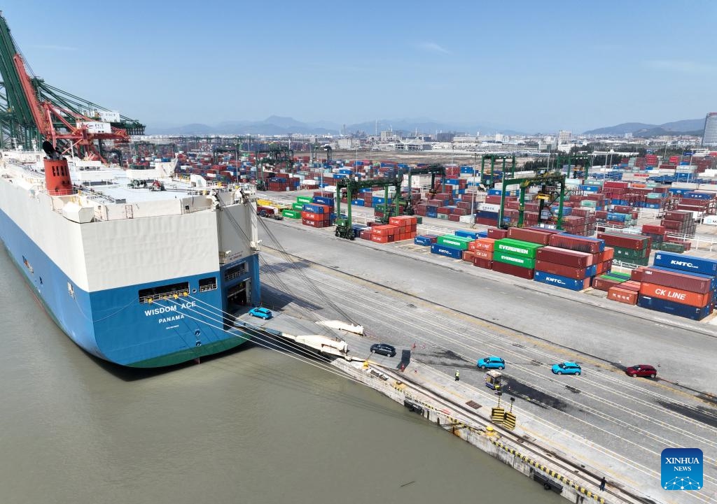 An aerial drone photo taken on March 12, 2024 shows vehicles for export being loaded into a ro-ro cargo vessel at Jiangyin terminal of Fuzhou Port in Fuzhou, southeast China's Fujian Province.(Photo: Xinhua)