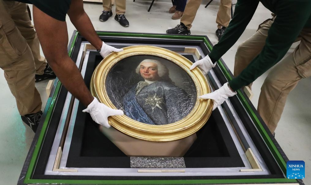 Staff members pack an exhibit at the Palace of Versailles in Paris, France, March 11, 2024. To celebrate the 60th anniversary of the establishment of diplomatic relations between France and China, the Palace of Versailles of France and the Palace Museum of China will jointly hold an exhibition from April to June at the Palace Museum in Beijing, which will display the history of exchanges between the two countries.(Photo: Xinhua)