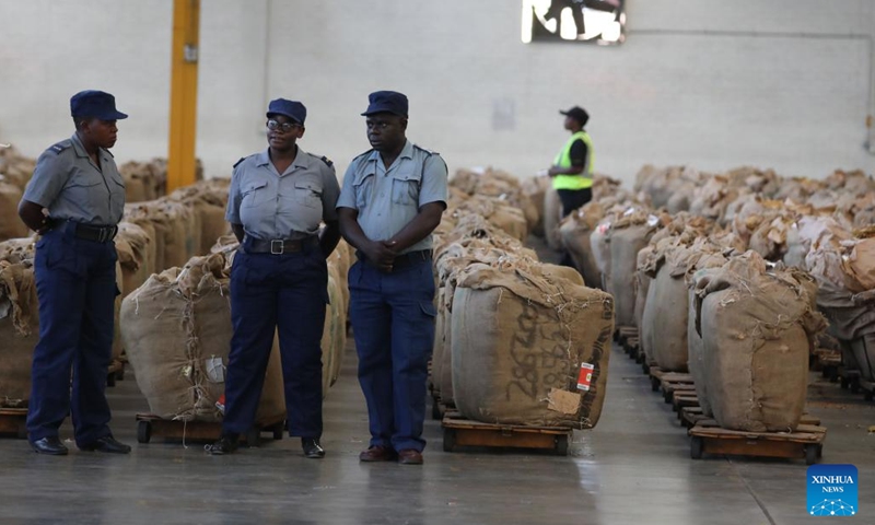 Zimbabwe Republic Police stand guard during the opening of the 2024 tobacco marketing season in Harare, Zimbabwe, on March 13, 2024. Zimbabwe's 2024 tobacco marketing season opened Wednesday, with increased calls for climate-proof tobacco production amid unpredictable rainfall patterns.(Photo: Xinhua)