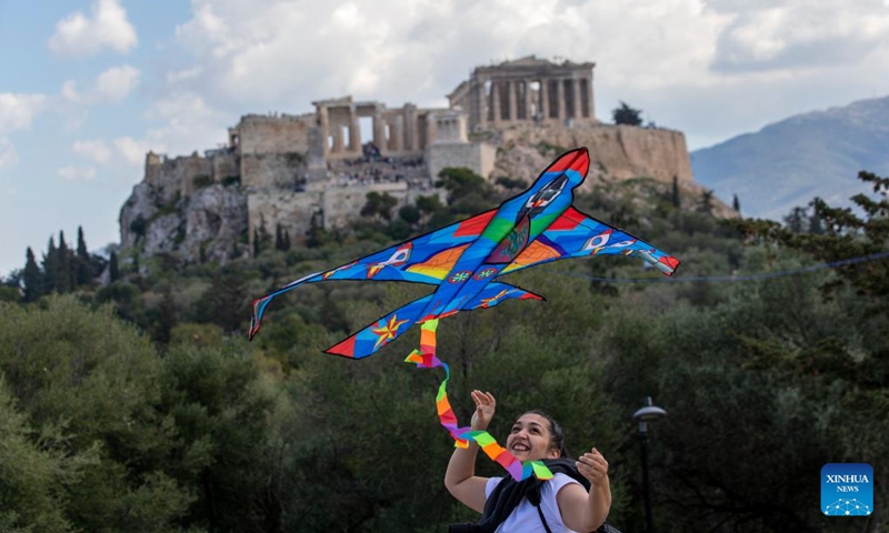 A woman flies a kite on the occasion of Clean Monday in Athens, Greece, on March 18, 2024.(Photo: Xinhua)