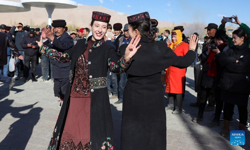 Residents dance in Warxidi village of Taxkorgan Tajik Autonomous County, northwest China's Xinjiang Uygur Autonomous Region, March 19, 2024. People in Taxkorgan Tajik Autonomous County celebrated their traditional sowing festival and drawing water festival on Tuesday. Marking the beginning of sowing seeds and drawing water, the festivals includes ceremonies to invoke good luck and good harvest. The festivals were also included in the state intangible cultural heritage list.(Photo: Xinhua)