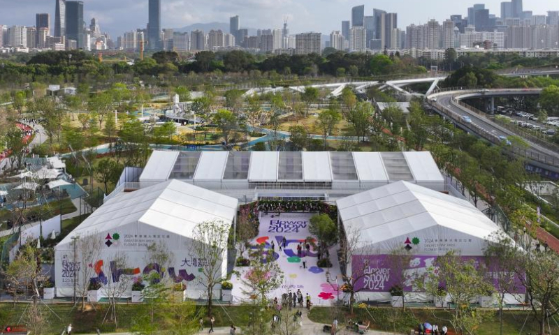 An aerial drone photo taken on March 22, 2024 shows a view of the Floral Runway, which consists of three exhibition pavilions, at the Greater Bay Area Flower Show in Shenzhen, south China's Guangdong Province. The Greater Bay Area Flower Show kicked off here on Saturday. Covering an exhibition area of more than 38,000 square meters, the event boasts 44 diverse gardens and will last until April 1. (Xinhua/Liang Xu)