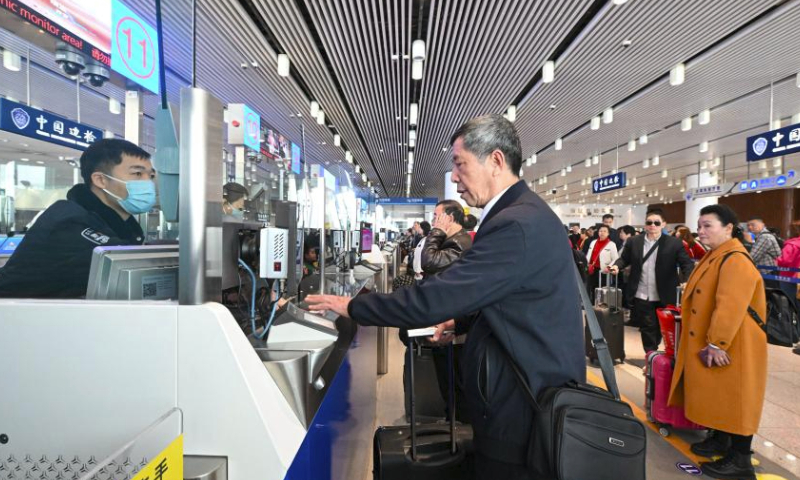 A police officer handles entry procedures of a passenger at Tianjin International Cruise Home Port in north China's Tianjin Municipality, March 23, 2024. As the largest cruise home port in north China, Tianjin International Cruise Home Port has handled more than 200,000 inbound and outbound passengers since its full resumption of international cruise ship transport on Sept. 27, 2023.

The port is expected to welcome over 120 international cruise ships in 2024. (Xinhua/Sun Fanyue)