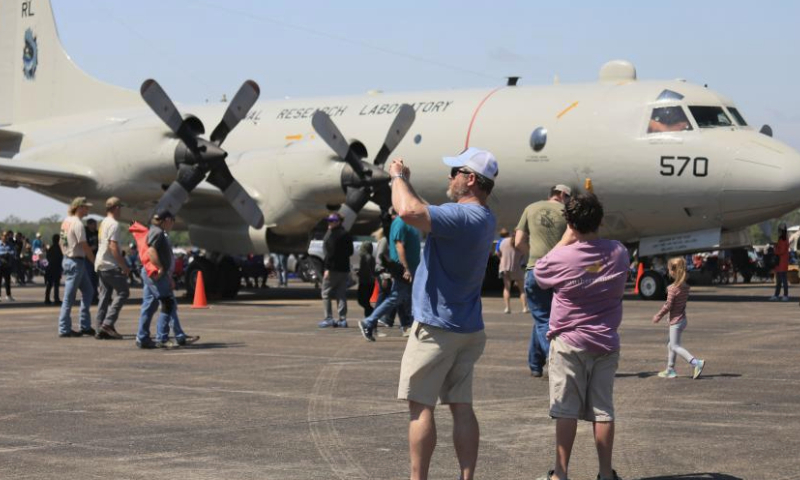 People take pictures of the aircraft during the New Orleans Airshow at Naval Air Station Joint Reserve Base in Belle Chasse, Louisiana, the United States, March 23, 2024. (Photo by Lan Wei/Xinhua)