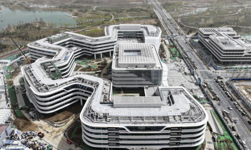 An aerial drone photo taken on March 28, 2024 shows the construction site of the headquarters of China Satellite Network Group in Xiong'an New Area, north China's Hebei Province. In April 2017, China announced a plan to establish the Xiong'an New Area, which spans the Rongcheng, Anxin and Xiongxian counties, as well as some adjacent areas in north China's Hebei Province.

The new area aims to relieve Beijing of non-essential functions related to its status as the nation's capital, while also advancing the coordinated development of the Beijing-Tianjin-Hebei region.

The country has also vowed to build Xiong'an, dubbed the city of the future, into an innovative, green, smart and world-class city with blue skies, fresh air and clean water, in line with the country's high-quality development path. (Xinhua/Mu Yu)