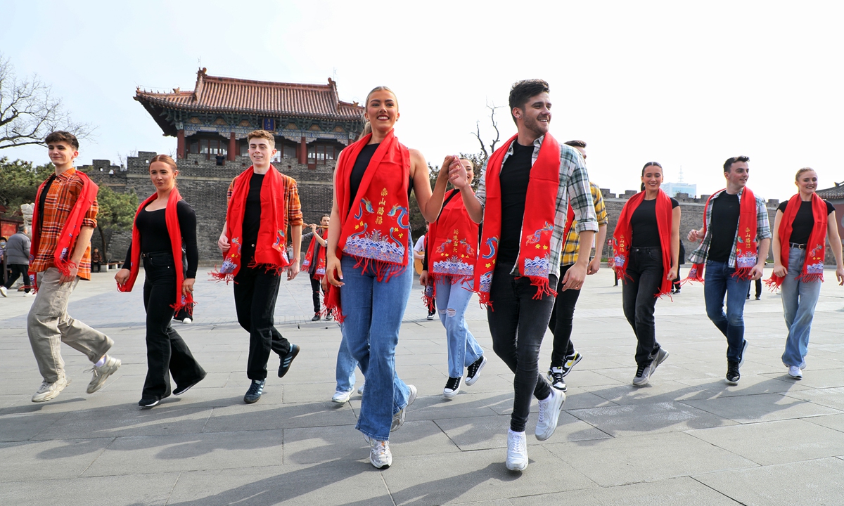 
A group of dancers from Ireland perform a lively and energetic tap dance at the foot of Taishan Mountain in Tai'an, East China's Shandong Province, on March 27, 2024. The collision of cultures captured the attention of visitors. Photo: VCG