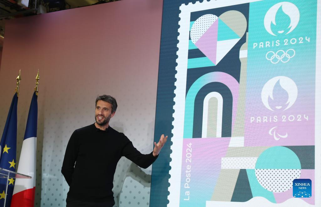 Tony Estanguet, President of the Paris 2024 Organizing Committee, attends the unveiling ceremony of the official stamp for the Paris 2024 Olympic and Paralympic Games at the French Postal Museum in Paris, France, March 26, 2024. Drawing inspiration from the visual identity of the Paris Olympics, the stamp highlights iconic places like the Eiffel Tower and the River Seine, with sporting elements of athletics tracks and ball bounces featured in it. The stamp has exceptional finishes with hot stamping.(Photo: Xinhua)