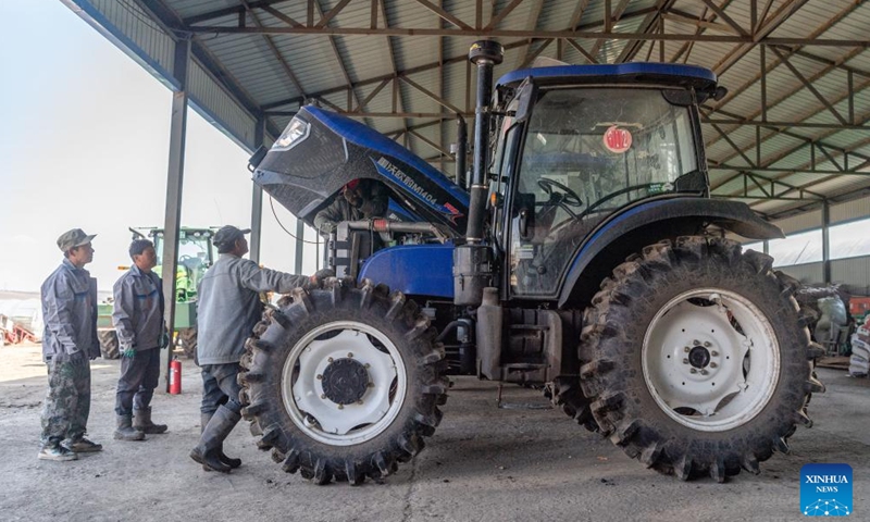 Workers maintain agricultural machinery at a cooperative for rice cultivation in Boli County, northeast China's Heilongjiang Province, April 3, 2024. China's major grain production province Heilongjiang, known as the country's grain barn, is conducting a wide range of activities to ensure a robust foundation for spring farming. (Xinhua/Xie Jianfei)