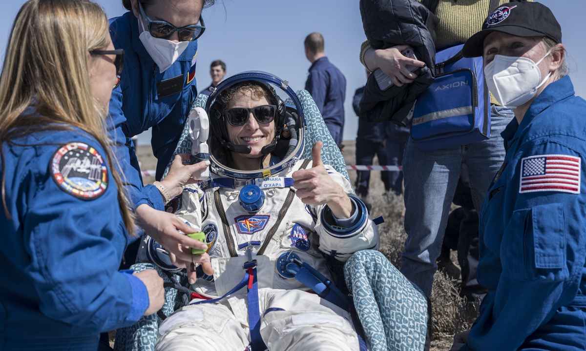 An astronaut sits in a chair shortly after the landing of the Russian Soyuz MS-24 space capsule near Zhezkazgan, Kazakhstan, on April 6, 2024 after their missions aboard the International Space Station. Photo: IC