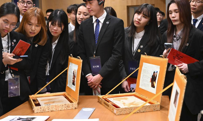 Members of a delegation of young people from Taiwan led by Ma Ying-jeou, former chairman of the Chinese Kuomintang party, visit the resource center of the National Center for the Performing Arts (NCPA) in Beijing, capital of China, April 7, 2024. Ma and the Taiwan youth delegation led by him visited the NCPA on Sunday. (Xinhua/Chen Yehua)