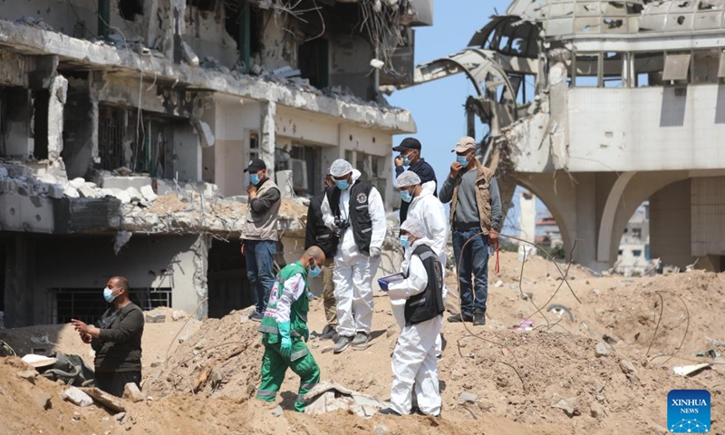 Staff members work near Al-Shifa Hospital in Gaza City, April 8, 2024.(Photo: Xinhua)