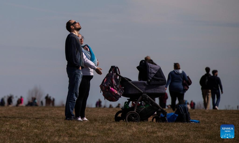 People observe a total solar eclipse in Port Stanley, Ontario, Canada on April 8, 2024.(Photo: Xinhua)