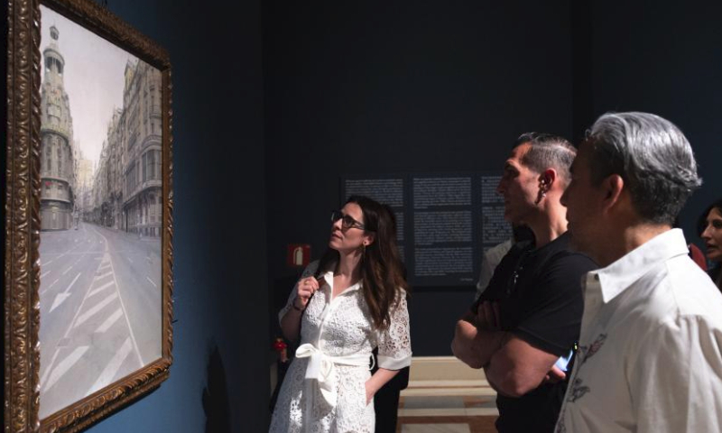 Visitors view an exhibition featuring contemporary oil paintings from China and Spain at Palacio Real, in Madrid, Spain, on April 12, 2024. (Photo by Gustavo Valiente/Xinhua)