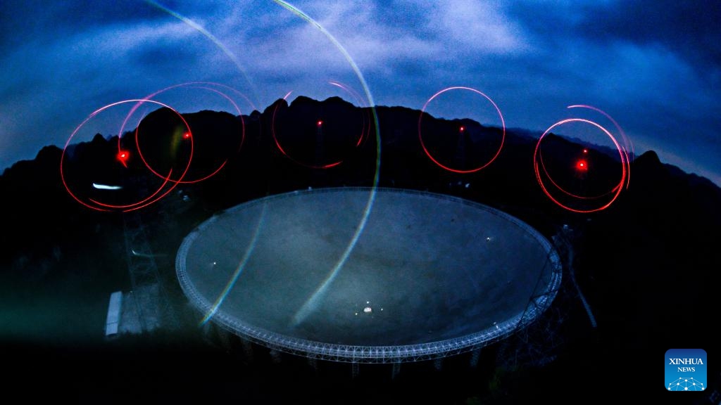 This photo taken on Feb. 26, 2024 with physical filter shows China's Five-hundred-meter Aperture Spherical Radio Telescope (FAST) under maintenance in southwest China's Guizhou Province. China's Five-hundred-meter Aperture Spherical Radio Telescope (FAST), the world's largest single-dish radio telescope, has identified more than 900 new pulsars since its launch in 2016, its operator said Wednesday.(Photo: Xinhua)