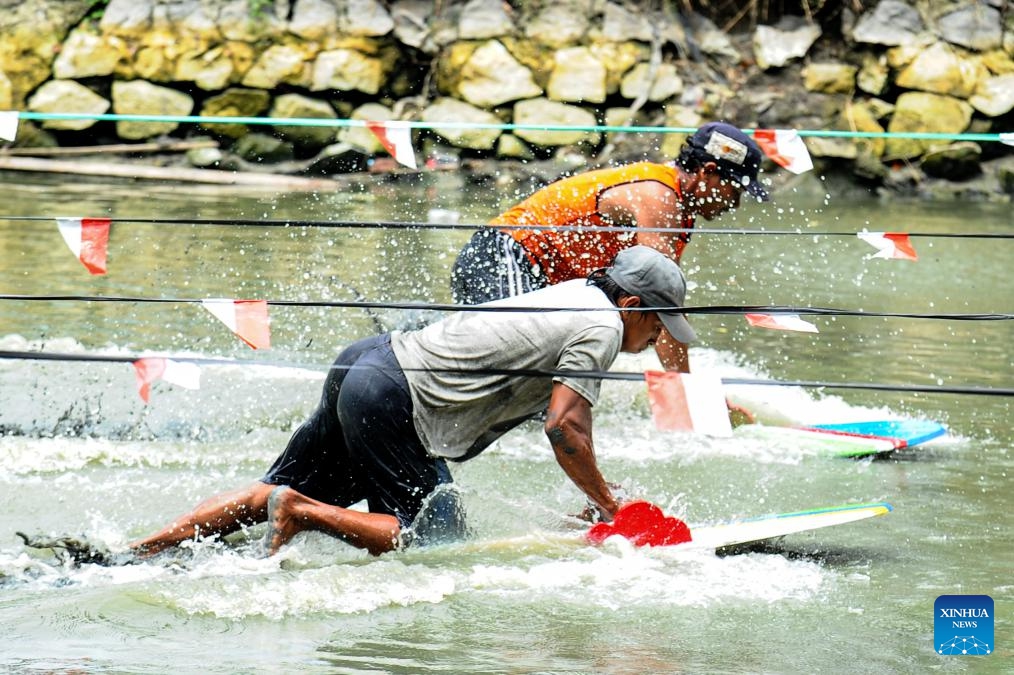 Fishermen participate in traditional mud surfing race as part of the Eid al-Fitr celebrations in Pasuruan, East Java, Indonesia, April 17, 2024.(Photo: Xinhua)