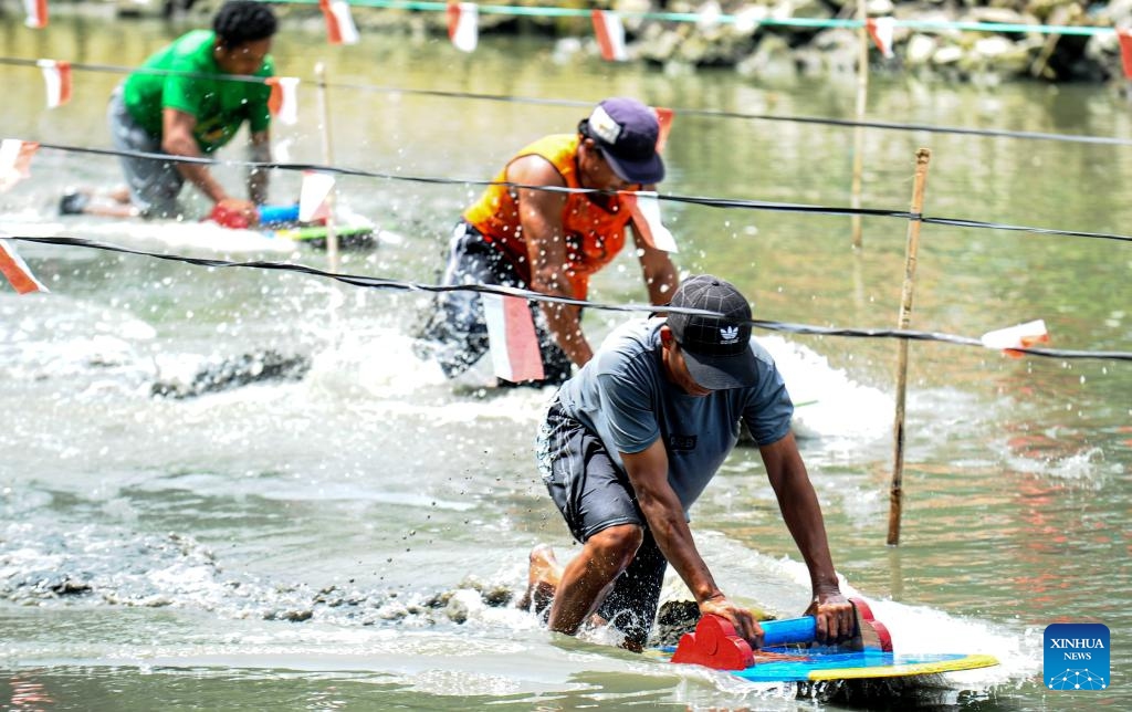 Fishermen participate in traditional mud surfing race as part of the Eid al-Fitr celebrations in Pasuruan, East Java, Indonesia, April 17, 2024.(Photo: Xinhua)