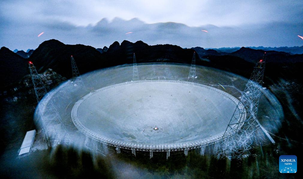 This photo taken on Feb. 26, 2024 with physical filter shows China's Five-hundred-meter Aperture Spherical Radio Telescope (FAST) under maintenance in southwest China's Guizhou Province. China's Five-hundred-meter Aperture Spherical Radio Telescope (FAST), the world's largest single-dish radio telescope, has identified more than 900 new pulsars since its launch in 2016, its operator said Wednesday.(Photo: Xinhua)