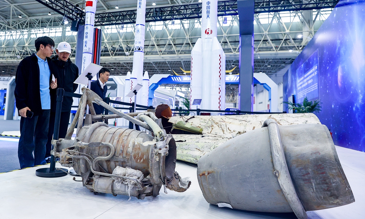 People view the physical remains of a Long March-3B carrier rocket engine in Wuhan, Central China's Hubei Province, on April 23, 2024, a day before the 2024 Space Day of China. A series of space science exhibitions will open to the public on that day. Photo: VCG