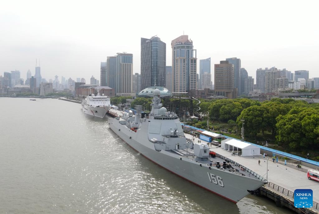 This aerial drone photo shows the guided-missile destroyer Zibo mooring at a port in east China's Shanghai, April 22, 2024. The Chinese People's Liberation Army Navy holds open day events in Shanghai on Tuesday to mark the 75th anniversary of its founding. Visitors could tour the guided-missile destroyer Zibo and hospital ship Peace Ark at the event.(Photo: Xinhua)