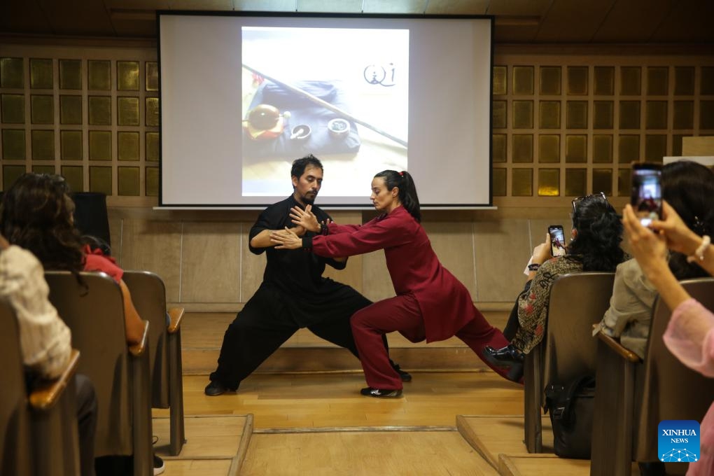 People watch a Chinese Kung Fu performance at a calligraphy exhibition in Mexico City, Mexico, April 20, 2024.(Photo: Xinhua)