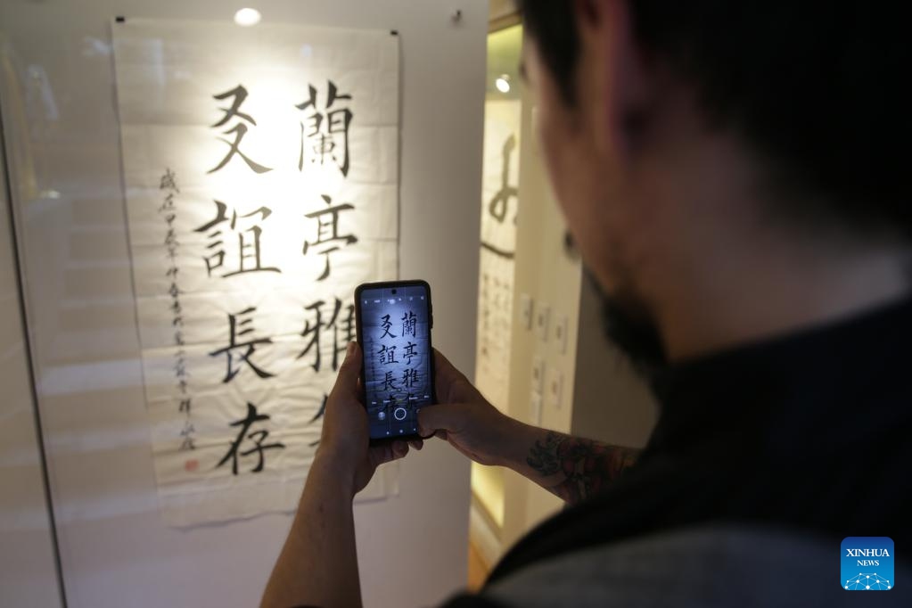 A man take photos of Chinese calligraphy at a calligraphy exhibition in Mexico City, Mexico, April 20, 2024.(Photo: Xinhua)