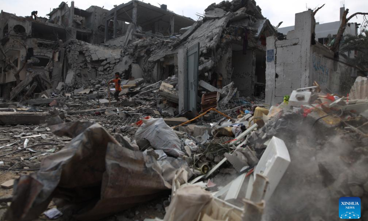 A boy walks among the rubble of a destroyed house in central Gaza Strip city of Deir el-Balah, on May 1, 2024. Photo:Xinhua