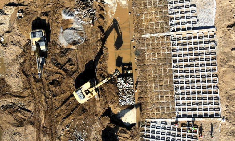 This aerial drone photo taken on May 1, 2024 shows a construction site of a river dam in Pingyi County, Linyi City, east China's Shandong Province. International Workers' Day is observed annually on May 1. (Photo by Wu Jiquan/Xinhua)