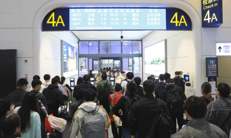 Passengers queue to check their tickets at Xuzhou East Railway Station in Xuzhou, east China's Jiangsu Province, on April 30, 2024. China's railway network is expected to handle 144 million passenger trips during the eight-day May Day holiday travel rush, the China State Railway Group Co., Ltd. said Monday. (Xinhua/Mao Jun)