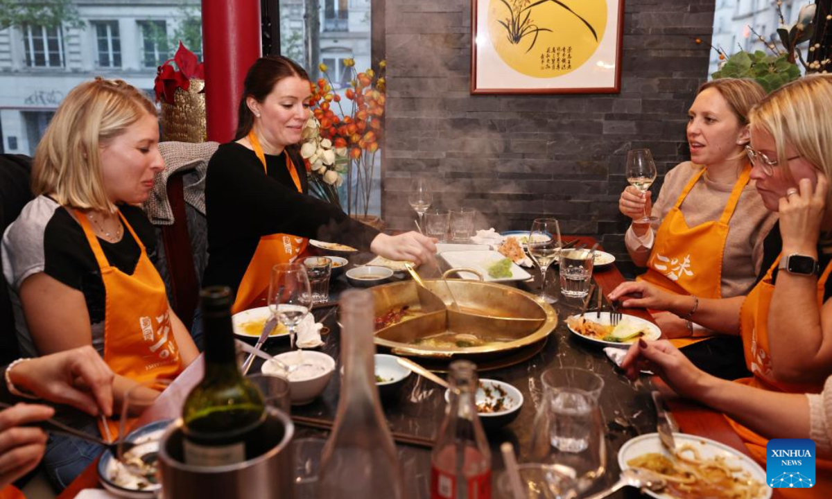 Customers dine at a hotpot restaurant in Paris, French, on April 21, 2024. In recent years, the city of Paris has witnessed a growing popularity of the Chinese hotpot. (Photo: Xinhua)