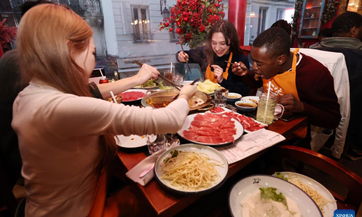 Customers dine at a hotpot restaurant in Paris, French, on April 21, 2024. In recent years, the city of Paris has witnessed a growing popularity of the Chinese hotpot. (Photo: Xinhua)