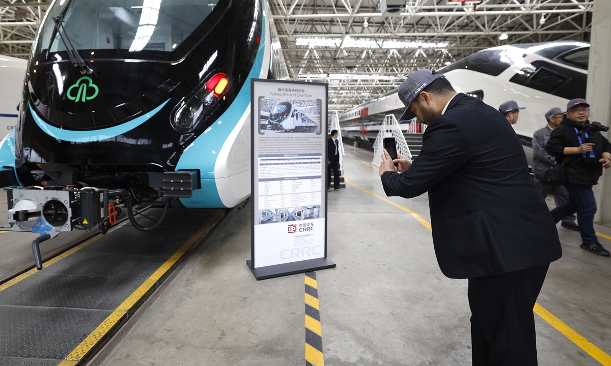 A representative takes photos at Chinese train maker CRRC Corporation Ltd in Tangshan, North China's Hebei Province on April 29, 2024. A group of diplomatic envoys and representatives  visited the production and development site of the high-speed trains. Photo: cnsphoto