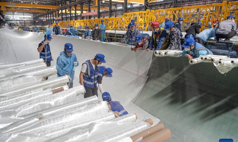 A staff member works at a workshop of China First Heavy Industries (CFHI) in Qiqihar, northeast China's Heilongjiang Province, April 28, 2024.

As a leading enterprise in equipment manufacturing in China, CFHI has made efforts to adopt green technologies, integrate the new energy equipment manufacturing into its main business, and form the complete industrial chain synchronously, improving manufacturing capability of wind turbines in Qiqihar and surrounding areas. (Xinhua/Xie Jianfei)