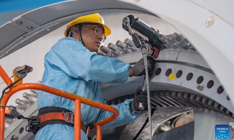 A staff member works at a workshop of China First Heavy Industries (CFHI) in Qiqihar, northeast China's Heilongjiang Province, April 28, 2024.

As a leading enterprise in equipment manufacturing in China, CFHI has made efforts to adopt green technologies, integrate the new energy equipment manufacturing into its main business, and form the complete industrial chain synchronously, improving manufacturing capability of wind turbines in Qiqihar and surrounding areas. (Xinhua/Xie Jianfei)